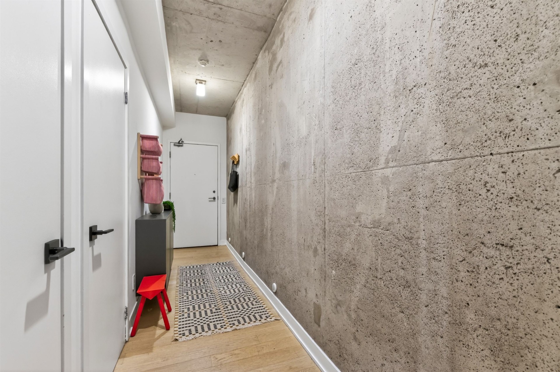 Suite 508 foyer detail with concrete and oak flooring