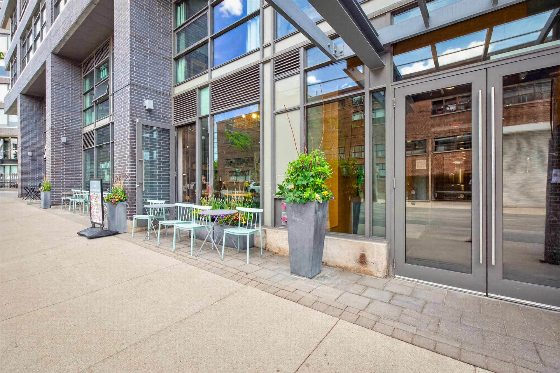 Street-level patio and storefronts at Work Lofts