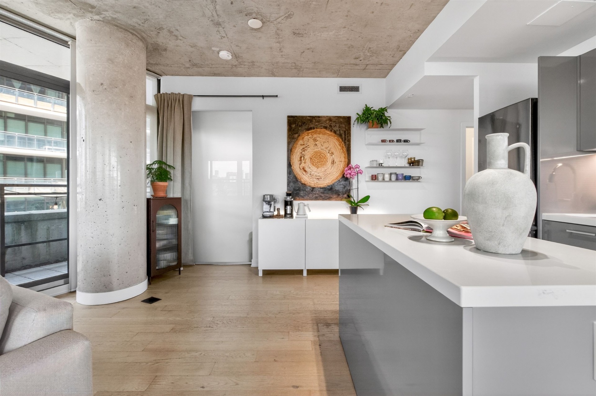 Kitchen island with concrete column and terrace access