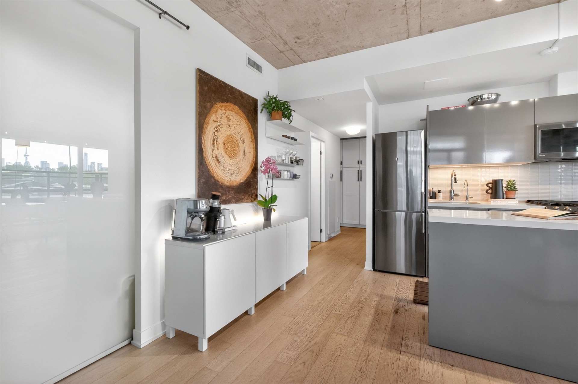 Kitchen hallway with coffee bar and stainless fridge