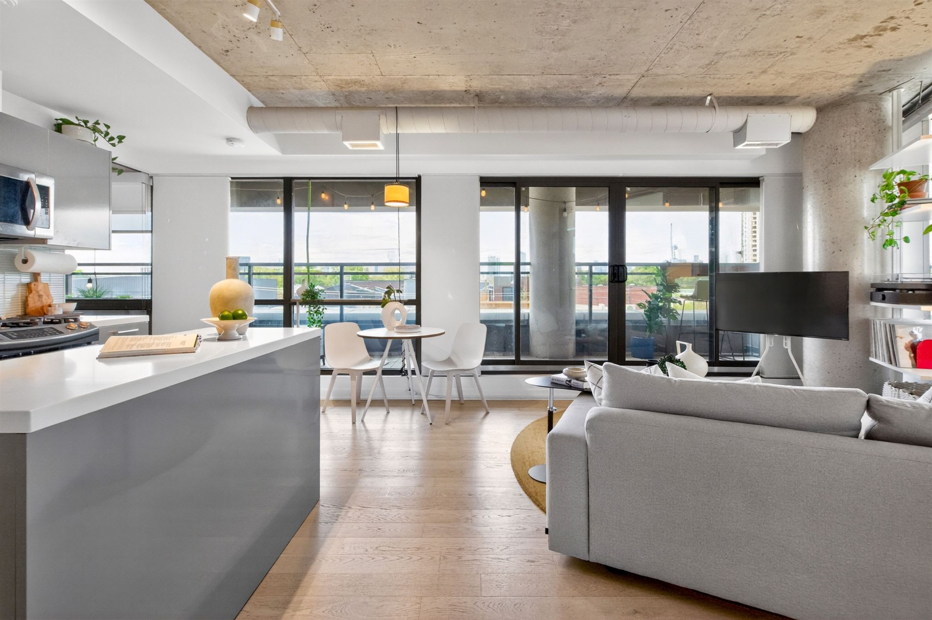 Living room with wraparound windows and skyline view