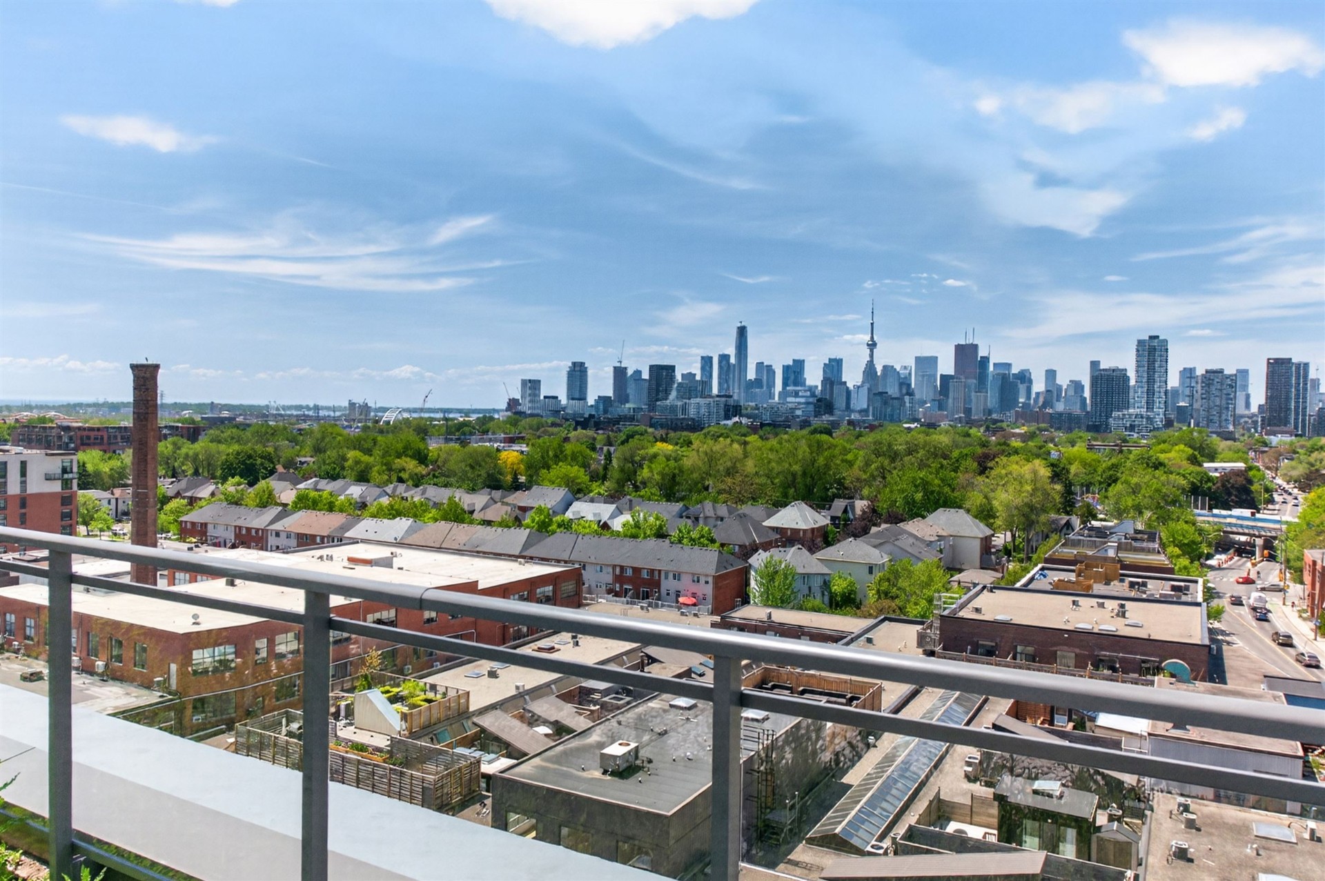 Panoramic rooftop view of Leslieville rooftops and downtown Toronto skyline