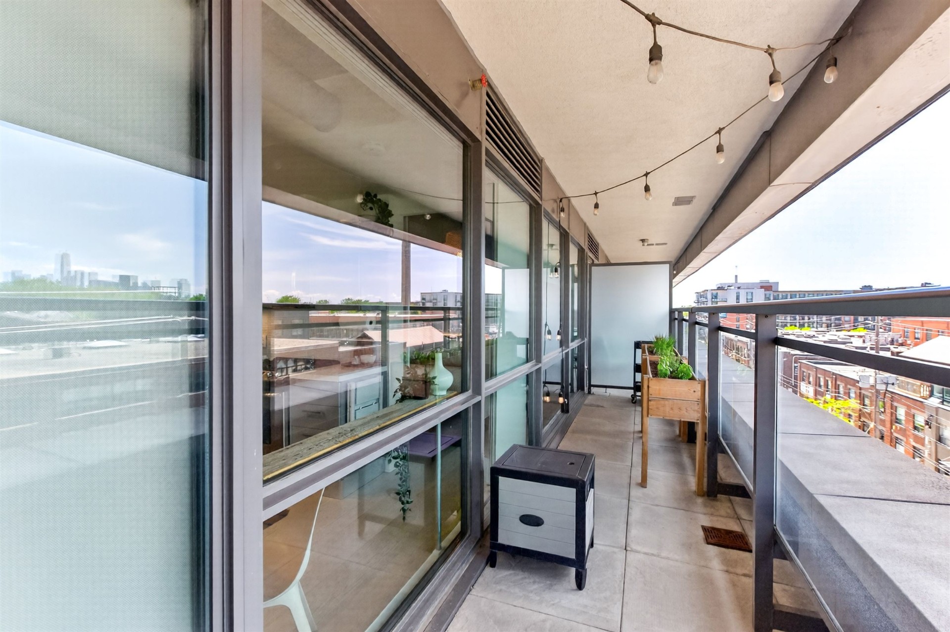 Terrace with sliding glass doors and city outlook