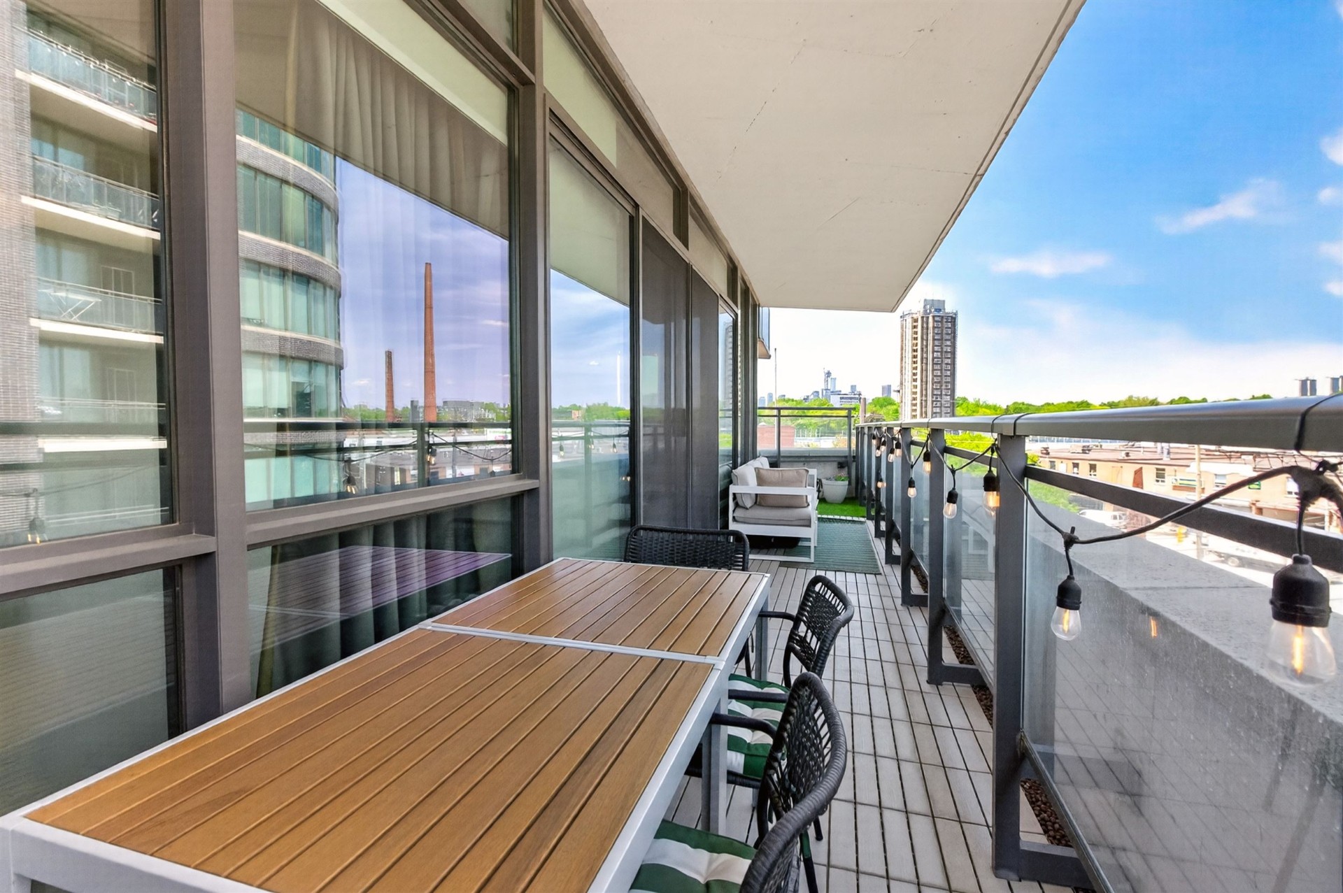 Terrace dining table with skyline and smokestack views