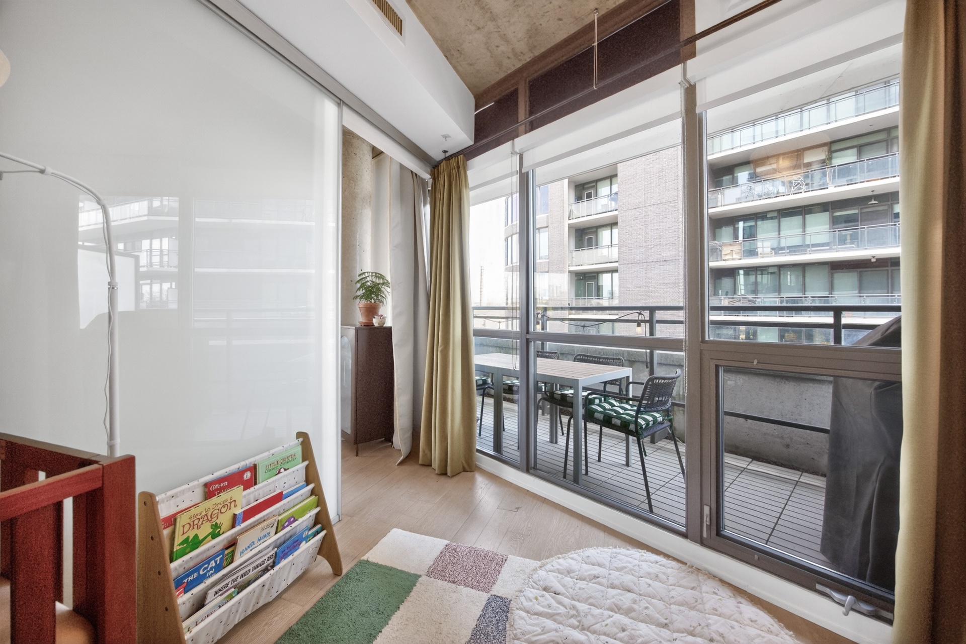 Second bedroom view to terrace through floor-to-ceiling windows