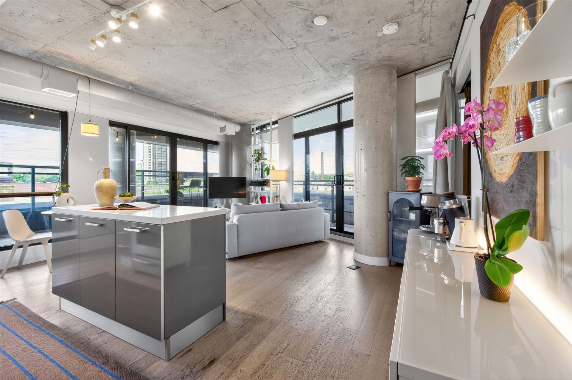 Open-concept kitchen and living area with terrace views