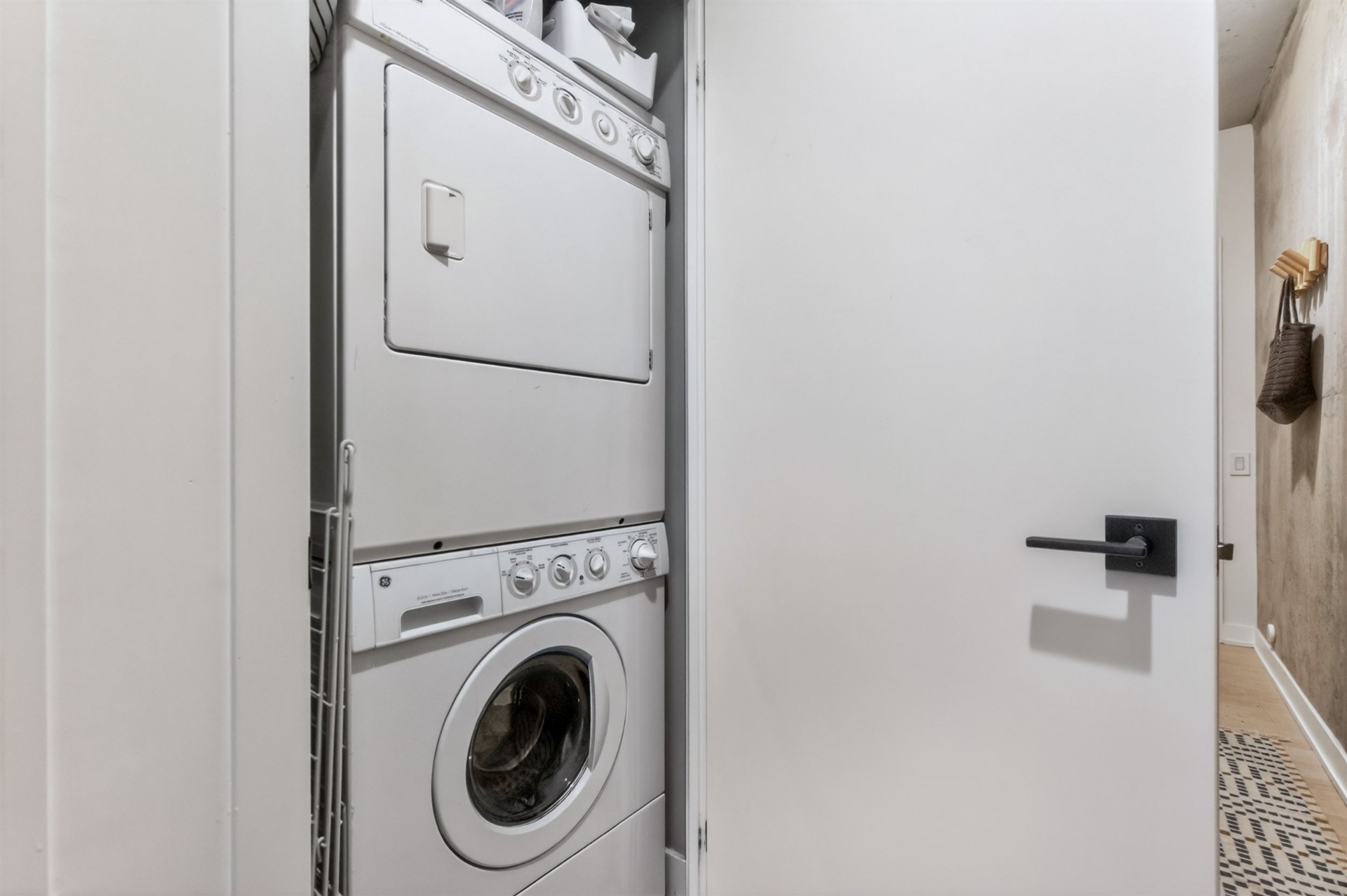 In-suite stacked washer and dryer in laundry closet